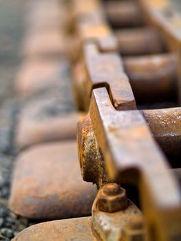 Old Rusty Continuous Tracks on Gravelly Ground