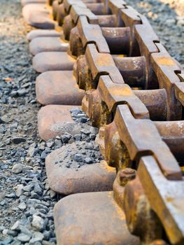 Old Rusty Continuous Tracks on Gravelly Ground