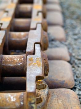 Old Rusty Continuous Tracks on Gravelly Ground