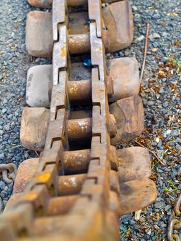 Old Rusty Continuous Tracks on Gravelly Ground