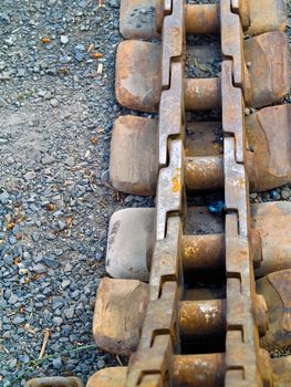 Old Rusty Continuous Tracks on Gravelly Ground