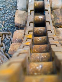 Old Rusty Continuous Tracks on Gravelly Ground