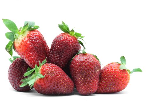 heap of strawberry fruit on white background