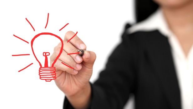 Asian business woman drawing light bulb for creativity concept