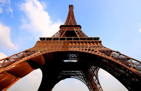 Eiffel tower in Paris with gorgeous colors and wide angle central perspective.