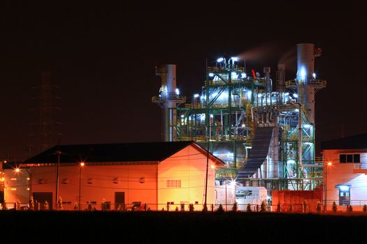 landscape of petrochemical oil refinery plant shines at night
