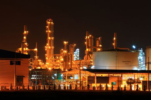 closeup of  petrochemical oil refinery plant and water storage tank