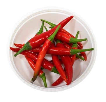 A red pepper in cup, isolated on a white background