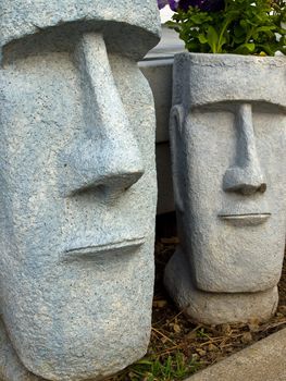 Easter Island Planters with Purple Flowers Growing