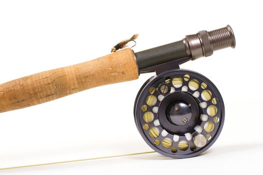 A hares ear bugger nymph is photographed in a lighting studio with a white background while rigged up and ready to fish on this fly rod and reel setup.