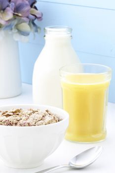 Delicious and healthy breakfast cereal with orange juice