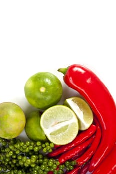 Mix food ingredient chili peppercone and lime on the white background with blank text message copy space