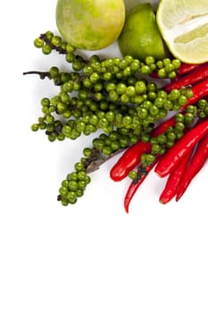 Mix food ingredient chili peppercone and lime on the white background with blank text message copy space