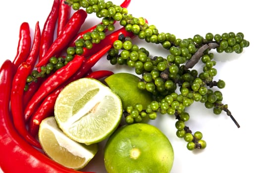 Mix food ingredient chili peppercone and lime on the white background