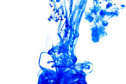 Blue ink isolated dissolving in water