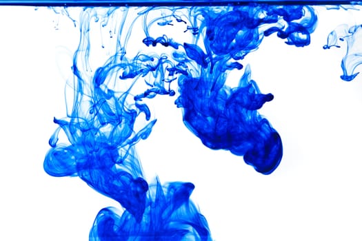 Blue ink isolated dissolving in water