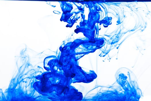 Blue ink isolated dissolving in water