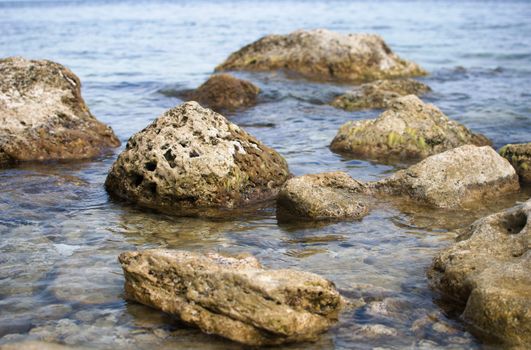 wierd old stones in the water, coastal landscape