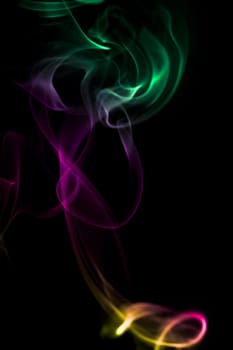 Multi color abstract smoke on black