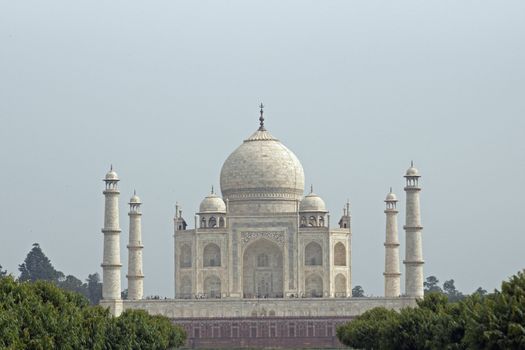Taj Mahal. White marble tomb set on raised platform topped by large oval dome. Agra, Uttar Pradesh. India