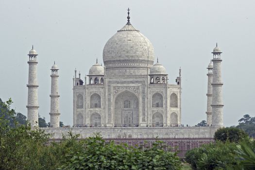 Taj Mahal. White marble tomb set on raised platform topped by large oval dome. Agra, Uttar Pradesh. India