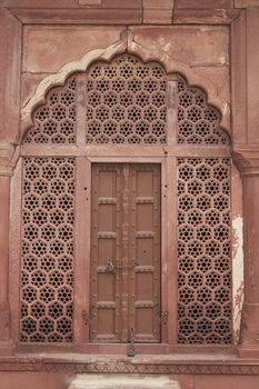 Taj Mahal. Detail of red sandstone doorway in perimeter wall surrounding landscaped gardens. Agra, Uttar Pradesh. India