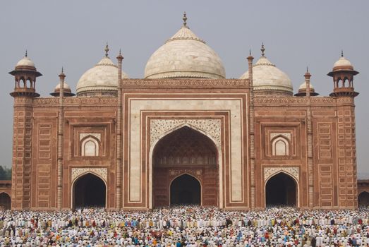 Thousands of people gather in front of the mosque at the Taj Mahal to celebrate the Muslim festival of Eid ul-Fitr in Agra, Uttar Pradesh, India