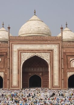 Thousands of people gather in front of the mosque at the Taj Mahal to celebrate the Muslim festival of Eid ul-Fitr in Agra, Uttar Pradesh, India