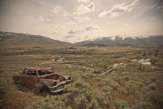 Old abandoned car with bullet holes. Reno Nevada high desert