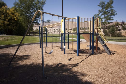 Playground on a clear summer day. Empty with no kids