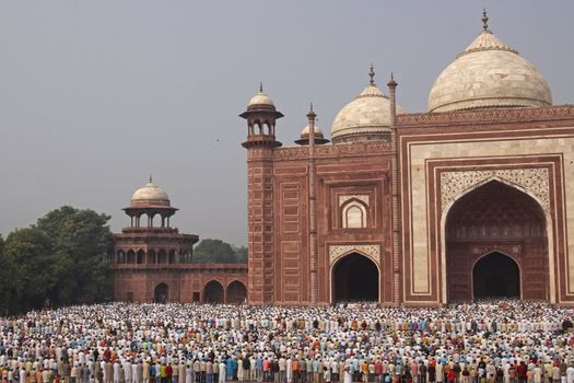 Thousands of people gather in front of the mosque at the Taj Mahal to celebrate the Muslim festival of Eid ul-Fitr in Agra, Uttar Pradesh, India