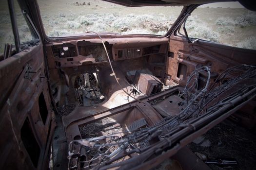 Old abandoned car with bullet holes. Reno Nevada high desert