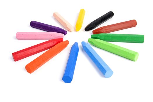 Colored wax crayons isolated on white background