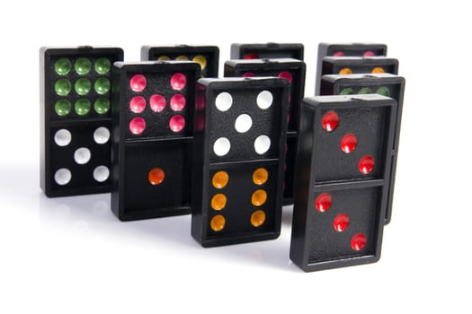 Domino pyramid on white background. Leisure and game concept.