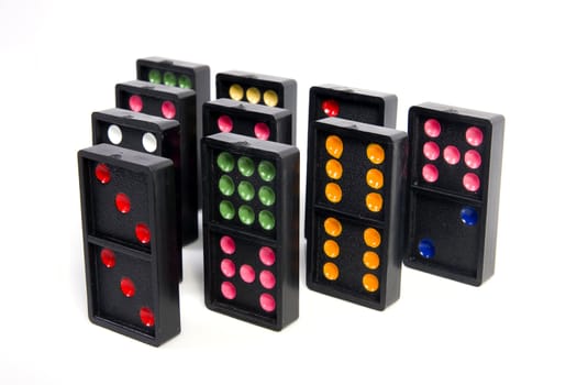 Domino pyramid on white background. Leisure and game concept.