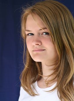 Girl with a glass of water looking at the camera