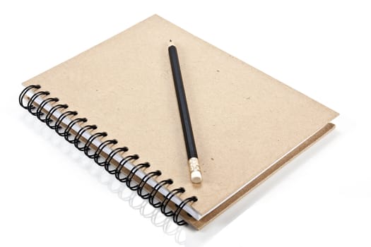 Hard cover notebook and pencil