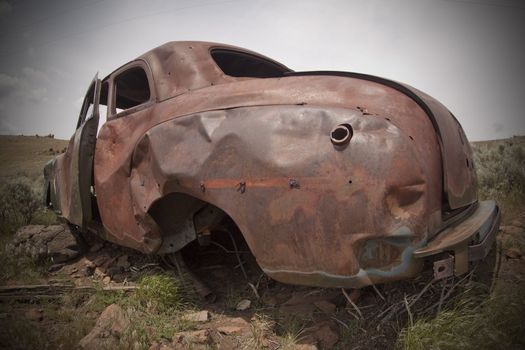 Old abandoned car with bullet holes. Reno Nevada high desert