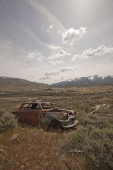 Old abandoned car with bullet holes. Reno Nevada high desert