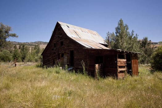 Old barn house with a blue clear sky