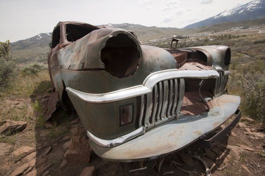 Old abandoned car with bullet holes. Reno Nevada high desert