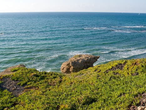 Beautiful Mediterranean coast landscape with clear blue sea and limestone rocks