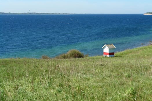 Coast seashore green meadow and soft hills Funen Denmark