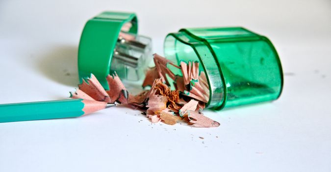 Sharpened pencil next to the sharpener