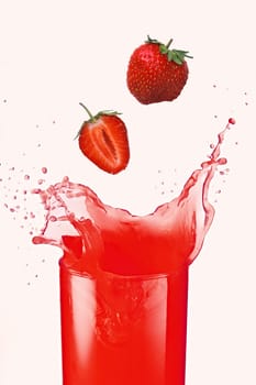 The strawberry falls in own juice isolated on white
