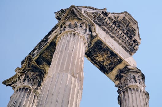 Antique portico against a blue sky. Rome, Italy