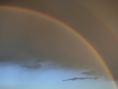 rainbow and gray clouds