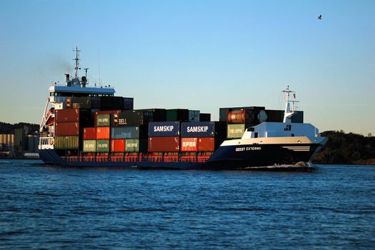 Containership going from Larvik, Norway. JR-Shipping,Geest-Externo,Harlingen,Netherland. Sailing under Dutch flag. Norway 2005.