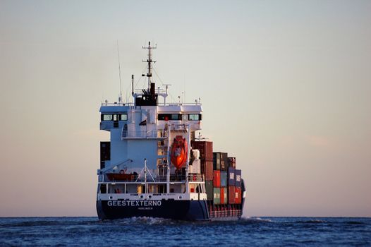 Containership going from Larvik, Norway. JR-Shipping,Geest-Externo,Harlingen,Netherland. Sailing under Dutch flag. Norway 2005.