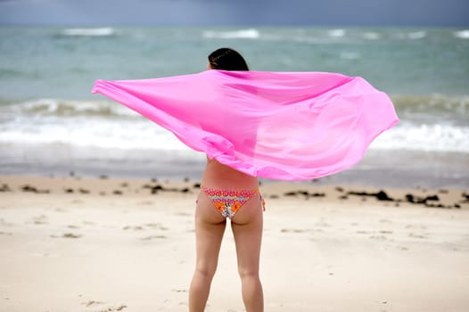 Woman enjoying the beach in Salvador de Bahia, Brazil